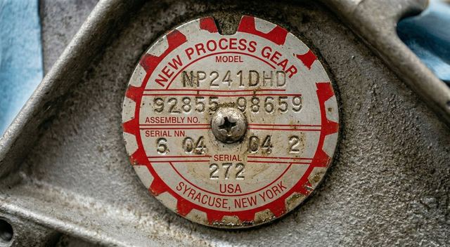 Close-up of OEM part identification tag on transfer case